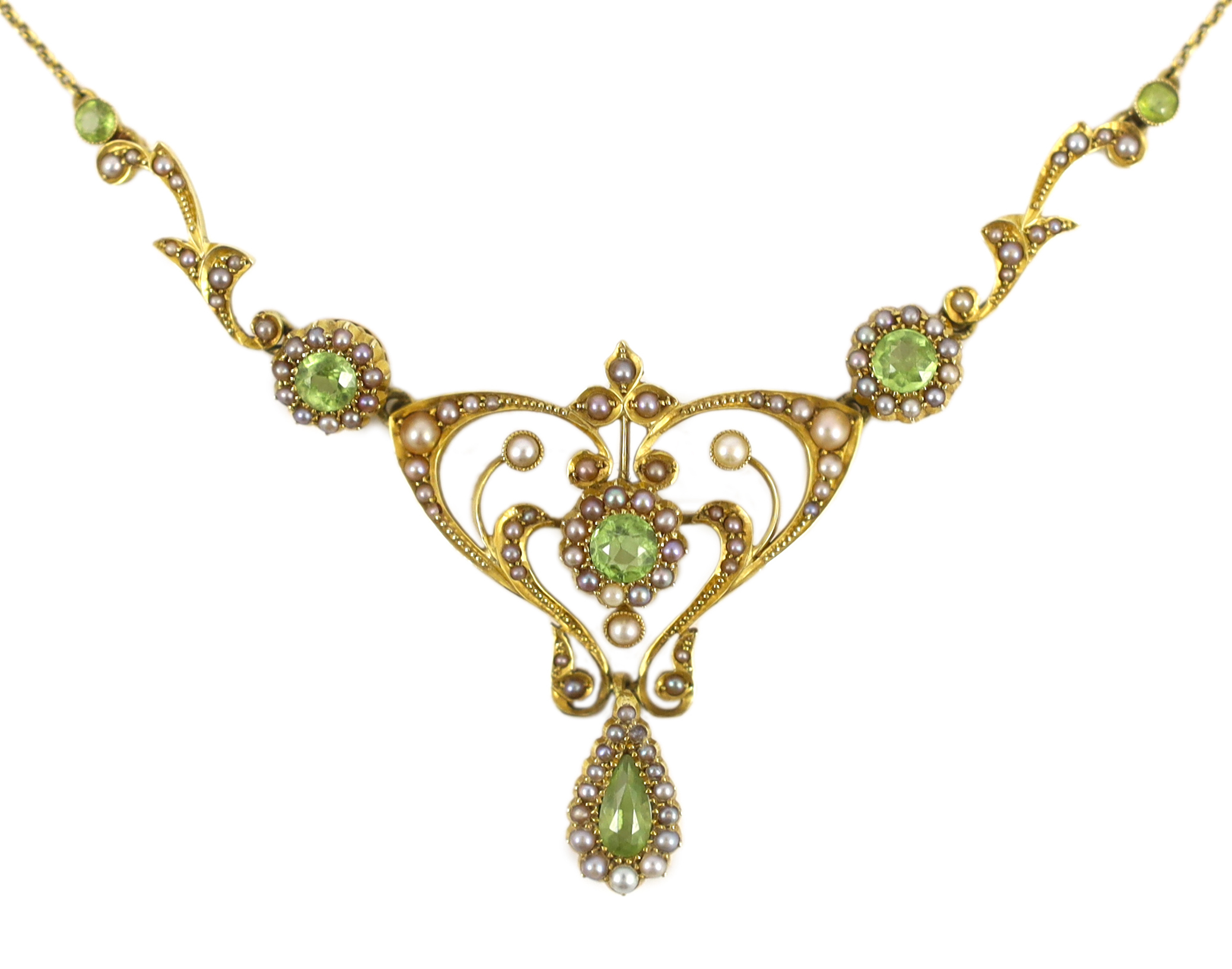 An Edwardian 15ct gold peridot and seed pearl cluster set drop pendant necklace